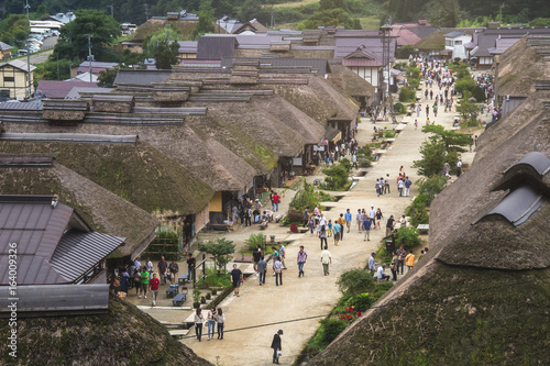 FUKUSHIMA,JAPAN - SEPTEMBER 7, 2013: Ouchijuku is a former post town along the Aizu-Nishi Kaido trade route, which connected Aizu with Nikko during the Edo Period. photo