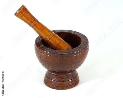 wooden mortar and pestle on white background 
