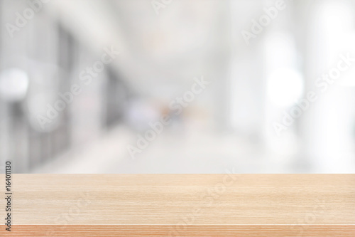 Wood table top on blurred hallway background