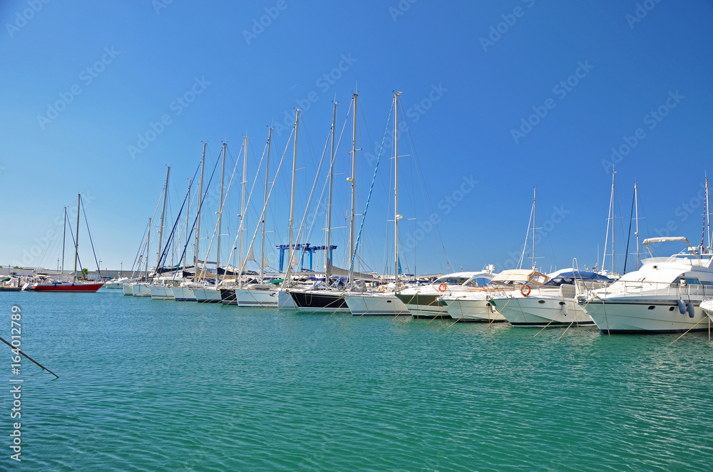 Sunny morning in the marina of Salerno with white yachts