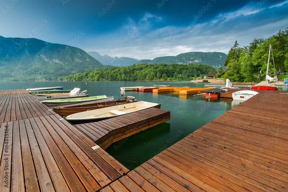 Picturesque pier with boats at Bohinj Lake,Slovenia