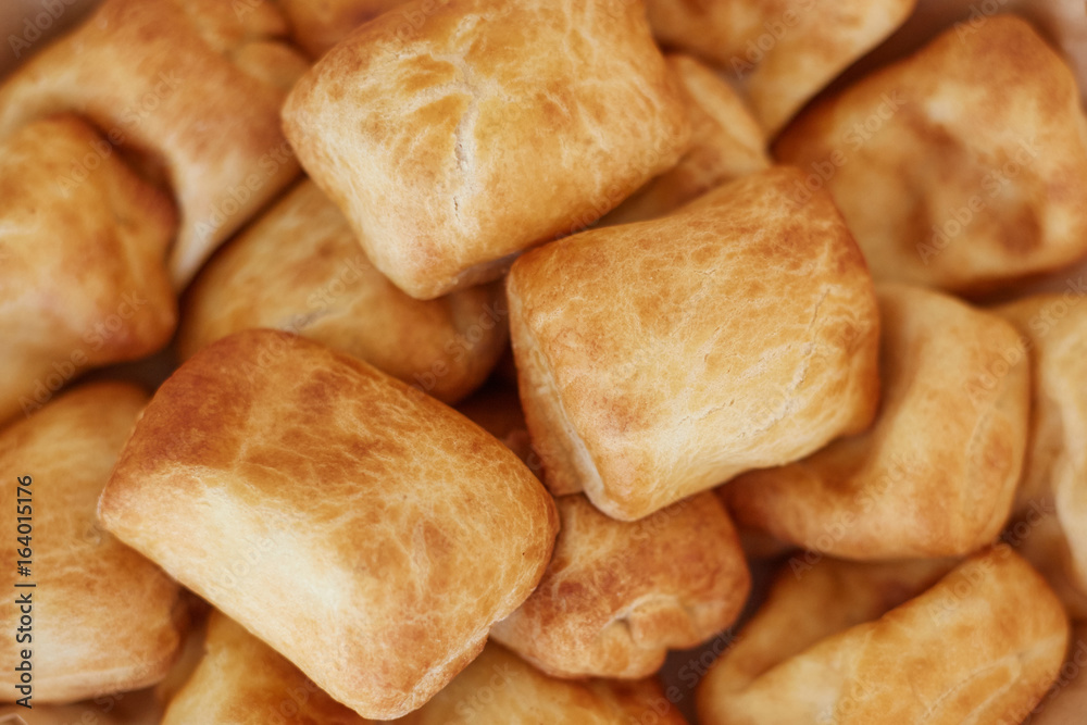 Basket with freshly baked sweet buns Basket with freshly baked sweet buns