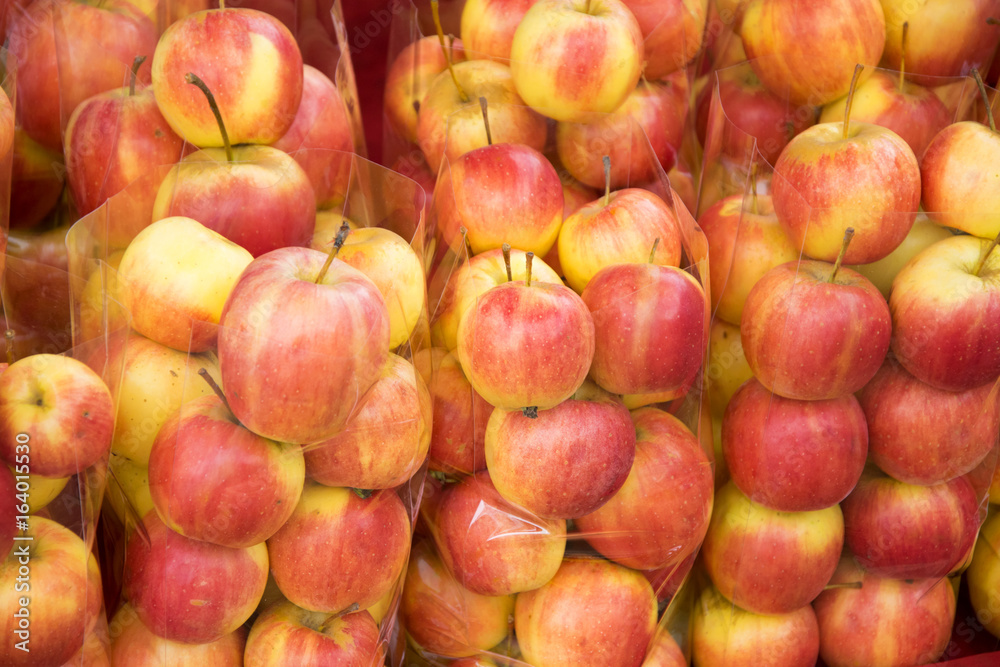 apple in plastic bag for sale at a market apple in plastic bag for sale at a market
