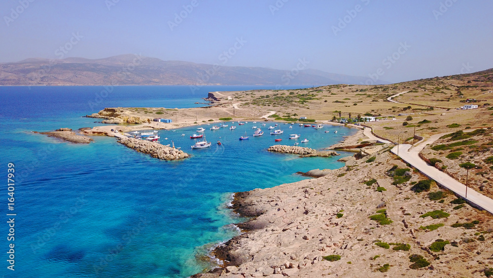 Aerial drone photo of small and safe bay of Parianos with docked fishing boats, Koufonissi island, small Cyclades, Aegean, Greece