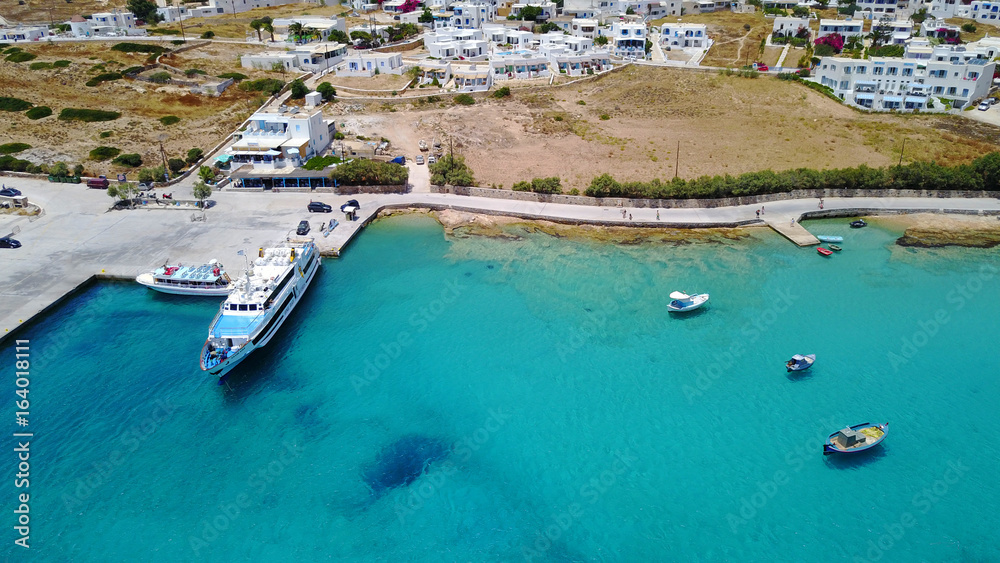 Aerial drone photo of iconic port of Koufonissi beach with docked fishing boats and turquoise waters, Koufonissi island, small Cyclades, Aegean, Greece
