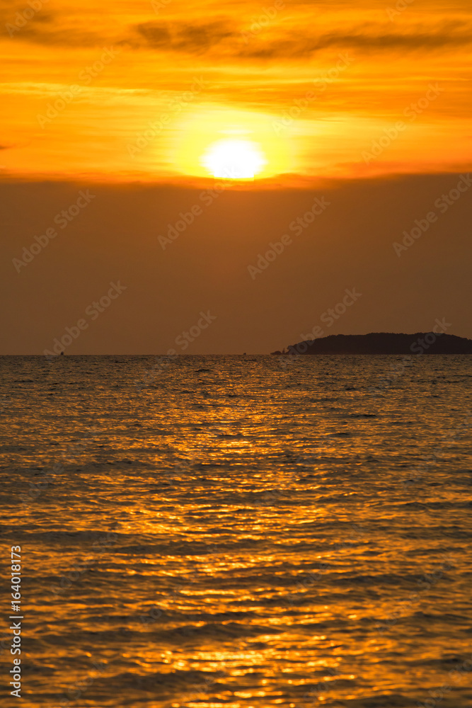 sunset time over the golden sky and sea or ocean water. sunset time over the golden sky and sea or ocean water.