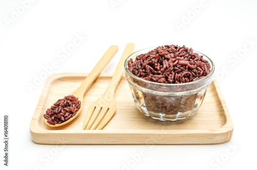 Rice Berry in a spoon and bowl on a white background.