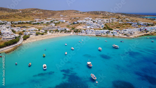 Aerial drone photo of iconic port of Koufonissi beach with docked fishing boats and turquoise waters, Koufonissi island, small Cyclades, Aegean, Greece