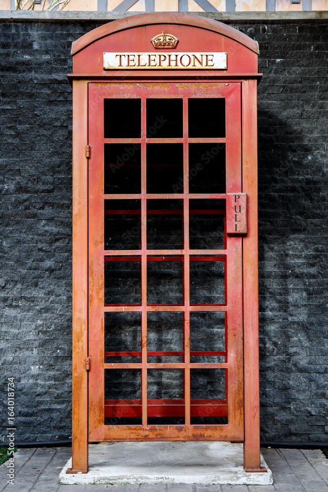 Obraz premium Vintage red telephone box europe english style.