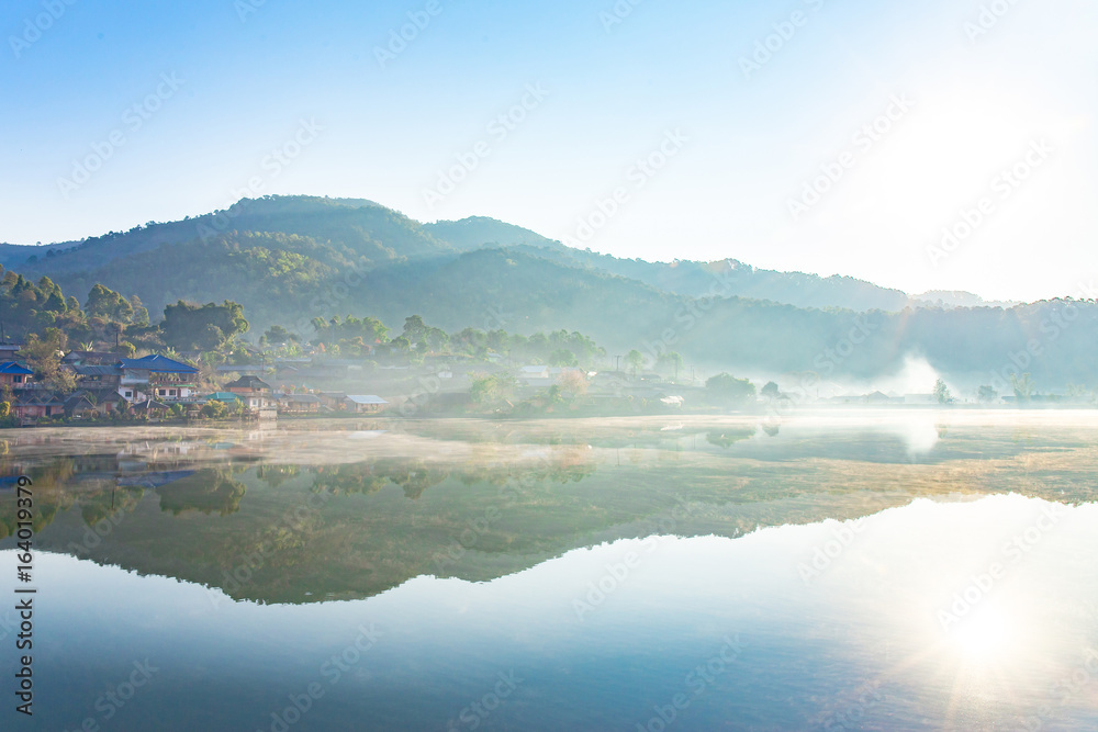 Landscape photo of morning with white fog over lake at Rak Thai village,Pang Oung, Mae Hong Son Thailand.