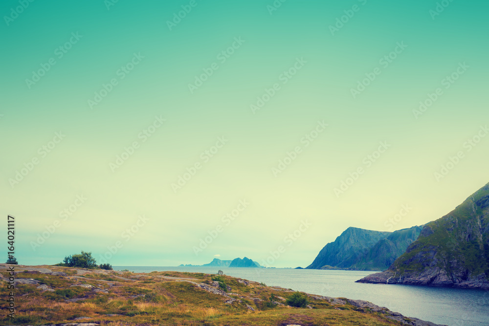 Rocky seashore with cloudy sky. Wilderness. Beautiful nature Norway. Lofoten islands Rocky seashore with cloudy sky. Wilderness. Beautiful nature Norway. Lofoten islands