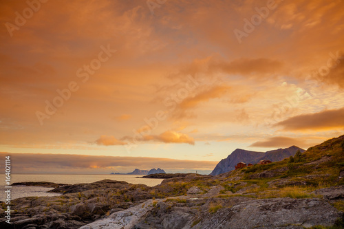 Rocky seashore at sunset. Wilderness. Beautiful nature Norway. Lofoten islands. Fishing village, Reine