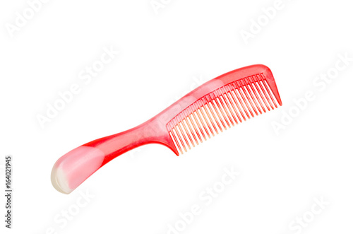 Red plastic comb isolated on white background with clipping path