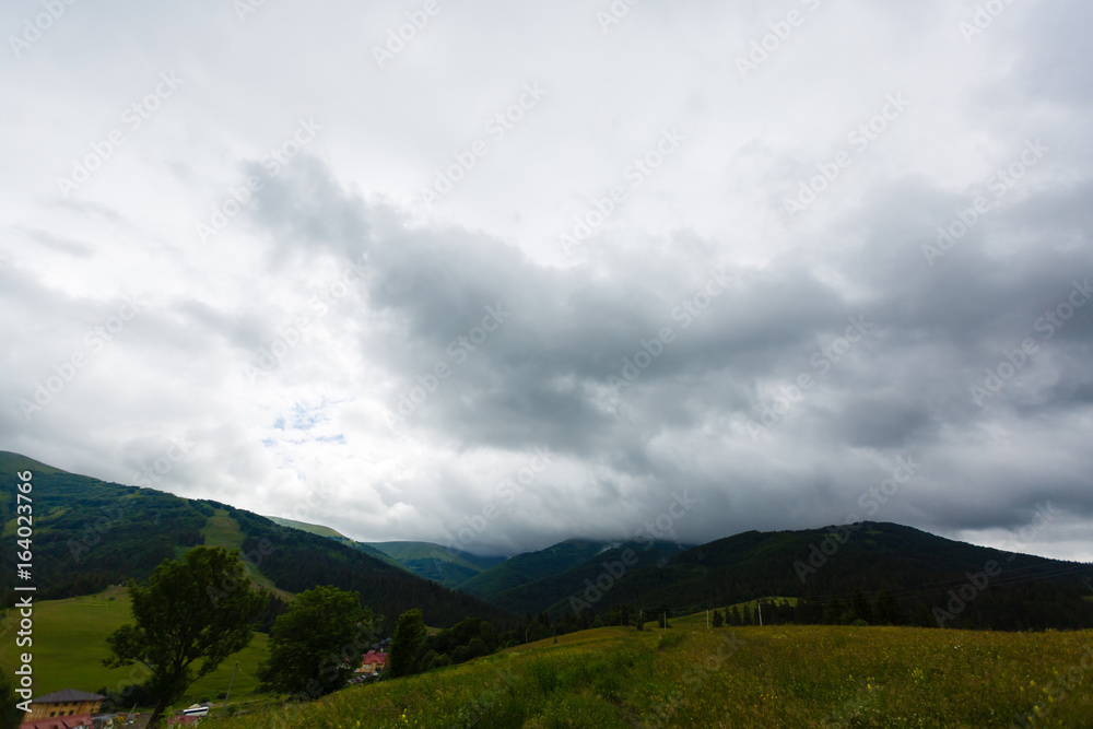 Fototapeta premium Photo of rainy clouds in Carpathian mountains