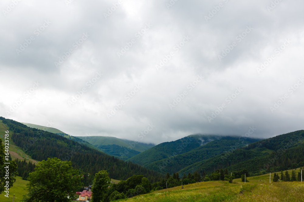 Photo of rainy clouds in Carpathian mountains