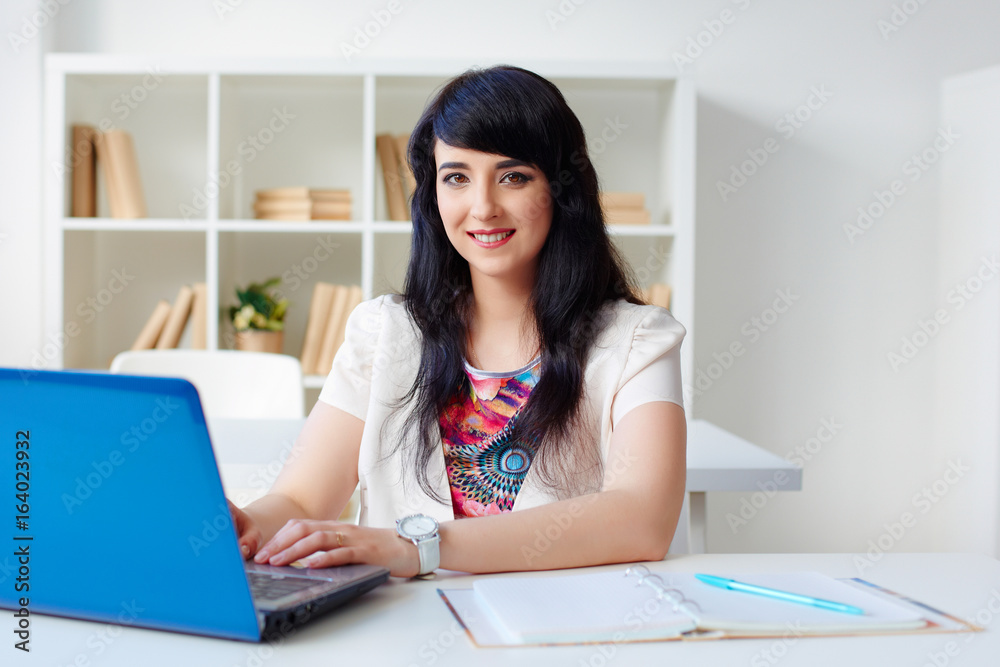 business woman working with laptop sitting at Desk in the office or classroom business woman working with laptop sitting at Desk in the office or classroom