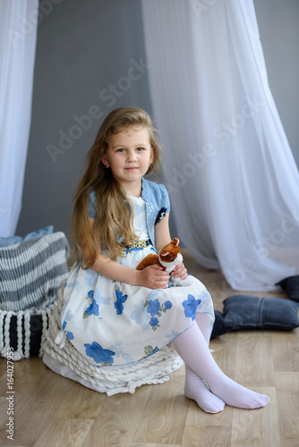 Happy funny child girl at home