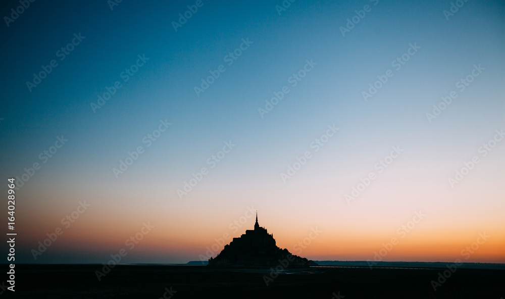 Le Mont Saint-Michel tidal island in beautiful twilight at dusk, Normandy, France