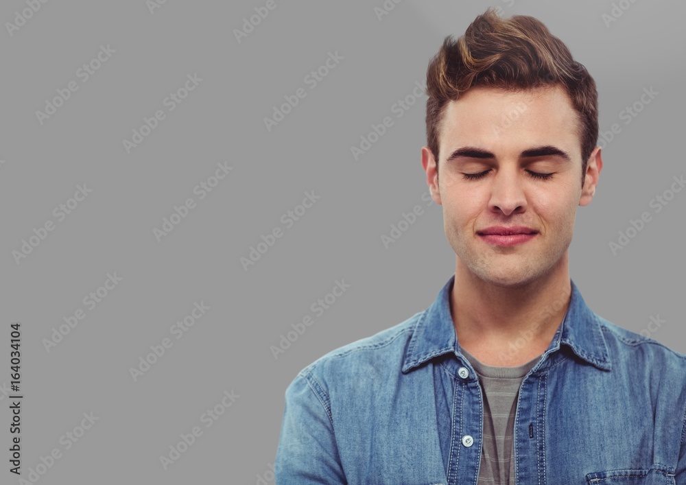 Portrait of Man with closed eyes with grey background Portrait of Man with closed eyes with grey background
