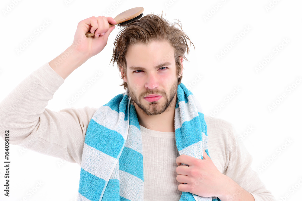Idea of morning routine. Man with concentrated face brushed hair Idea of morning routine. Man with concentrated face brushed hair