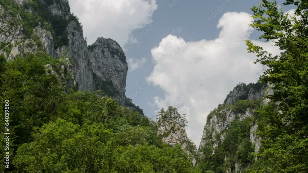Dynamic white clouds over Buila Mountains ridge, Romania. 4k timelapse. Dynamic white clouds over Buila Mountains ridge, Romania. 4k timelapse.