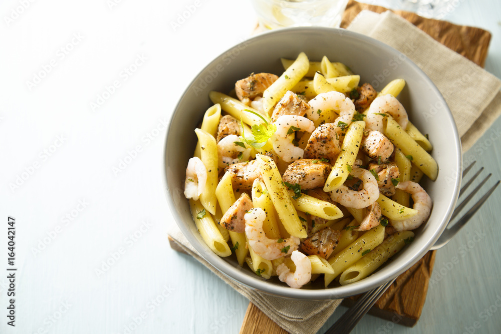 Pasta with fried salmon and shrimps