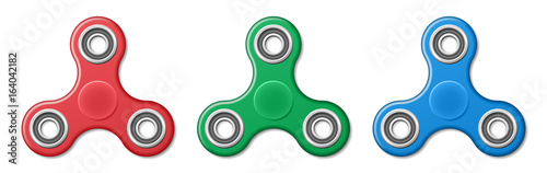 Set of Hand fidget spinner toys - stress and anxiety relief. Red, green and blue spinner plastic toys.