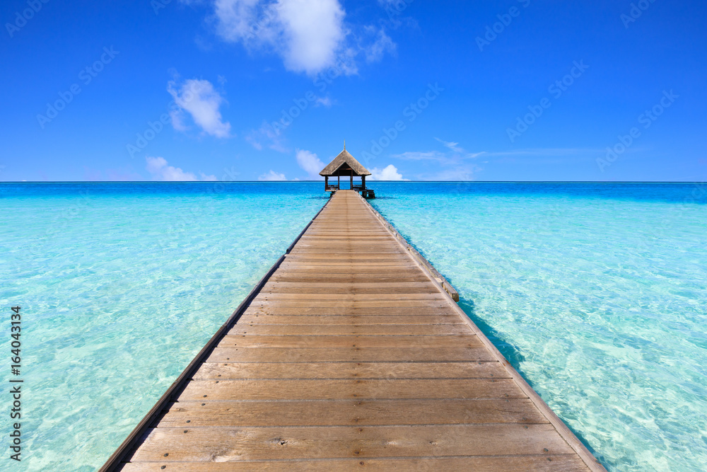 Wooden bridge and blue sea., Blue sky is the background 
