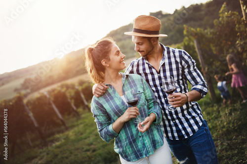 Winegrower family tasting wine photo