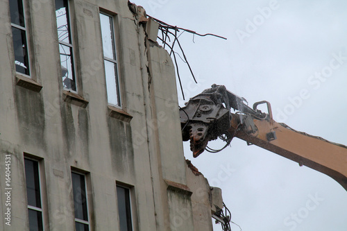 The Jaws of an Excavator Demolishing a Building.