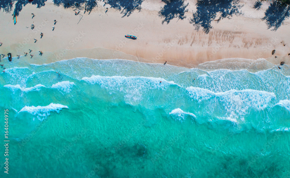 Sea aerial view,Top view,amazing nature background.The color of the water and beautifully bright.Azure beach with rocky mountains and clear water of Thailand ocean at sunny day.