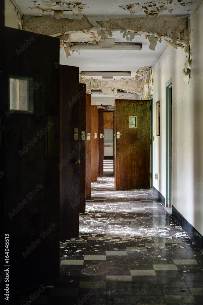 Derelict Hallway with Open Doors and Peeling Paint - Abandoned Hospital Derelict Hallway with Open Doors and Peeling Paint - Abandoned Hospital
