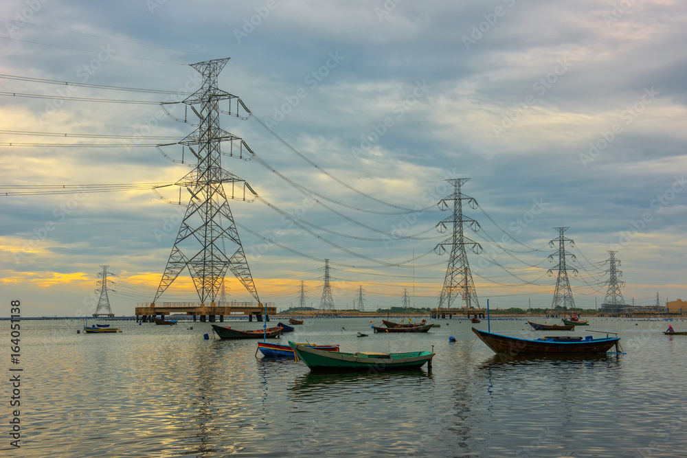 High voltage power pole in the sea and sky background.transmission tower.Electricity pylon.