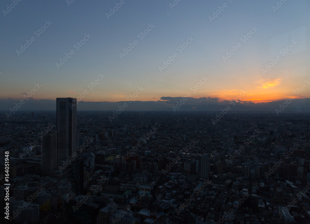 Sunset sky view through the glass of Tokyo Metropolitan Government Building observation
