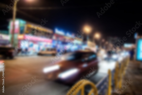blurred busy night street © chechotkin