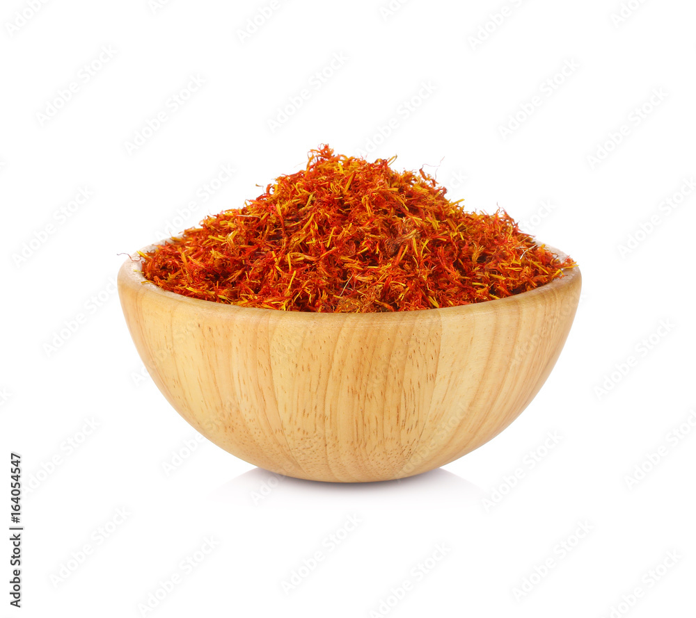 Safflower in a bowl on white background Safflower in a bowl on white background