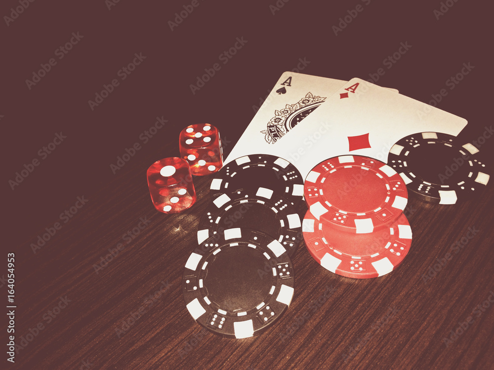 Black colours of poker game concept. Plot with bones, chips and cards Black colours of poker game concept. Plot with bones, chips and cards