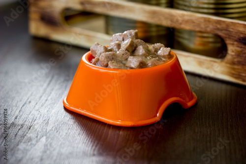 Canned pet food in a orange...