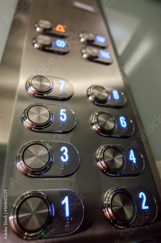 Elevator buttons inside elevator cabin pressing buttons