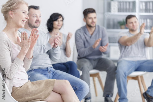Clapping at support group meeting