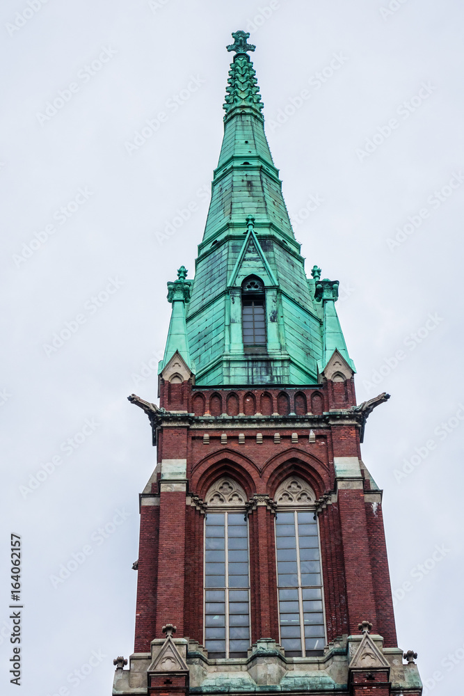 St. John's Church (Johanneksenkirkko, architect Adolf Melander, 1891) in Helsinki - a Lutheran church in Gothic Revival style. It is largest stone church in Finland by seating capacity. Finland. St. John's Church (Johanneksenkirkko, architect Adolf Melander, 1891) in Helsinki - a Lutheran church in Gothic Revival style. It is largest stone church in Finland by seating capacity. Finland.
