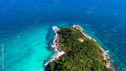 At Sea Island.Aerial view. Top view.amazing nature background.The color of the water and beautifully bright.Azure beach with rocky mountains and clear water of Thailand ocean at sunny day.