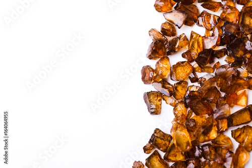 Fotografering Brown Amber stones on white background