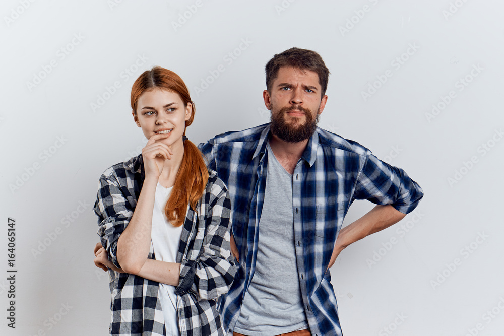 Young guy with beard and beautiful woman on white isolated background, repair, housework Young guy with beard and beautiful woman on white isolated background, repair, housework
