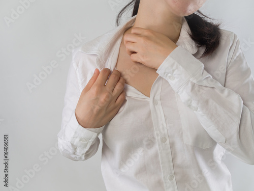 Young Asian woman scratching neck, concept of dermatitis health.