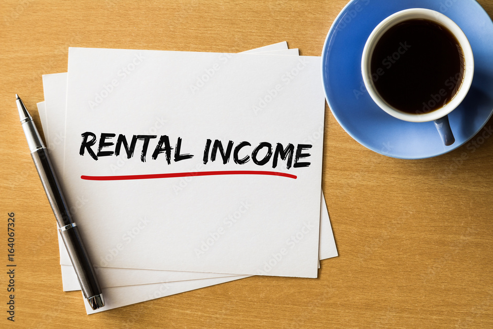 Rental Income - handwriting on papers with cup of coffee and pen, Business concept Rental Income - handwriting on papers with cup of coffee and pen, Business concept