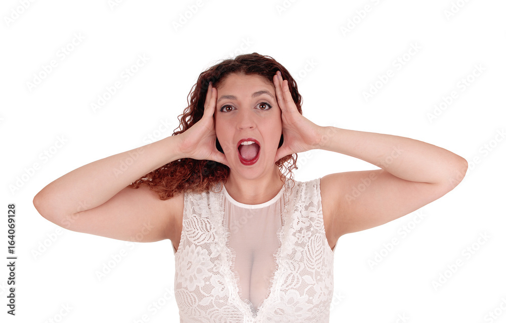 Woman shouting, hands on head.