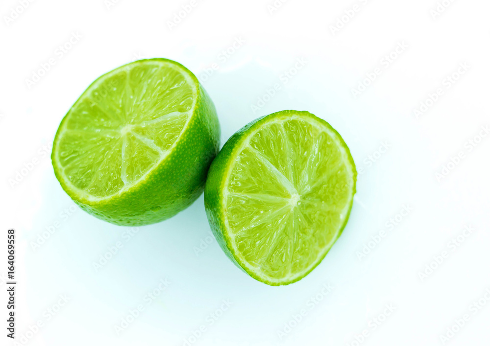 Juicy lime cut into two parts Juicy lime cut into two parts