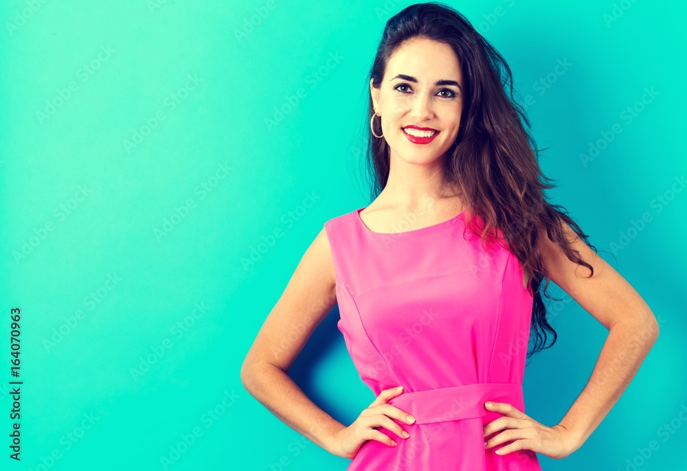 Happy young woman on a blue background Happy young woman on a blue background