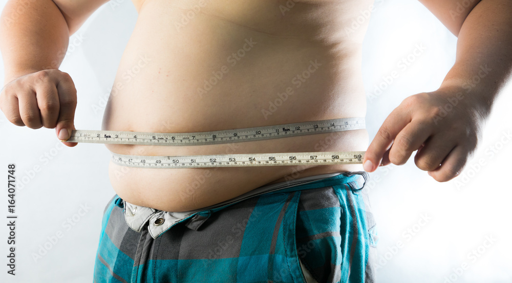 fat man check out his body fat with measuring tape for fat or obesity  background Stock Photo | Adobe Stock